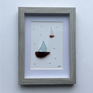 Handmade one-of-a-kind sea glass sailboat art.